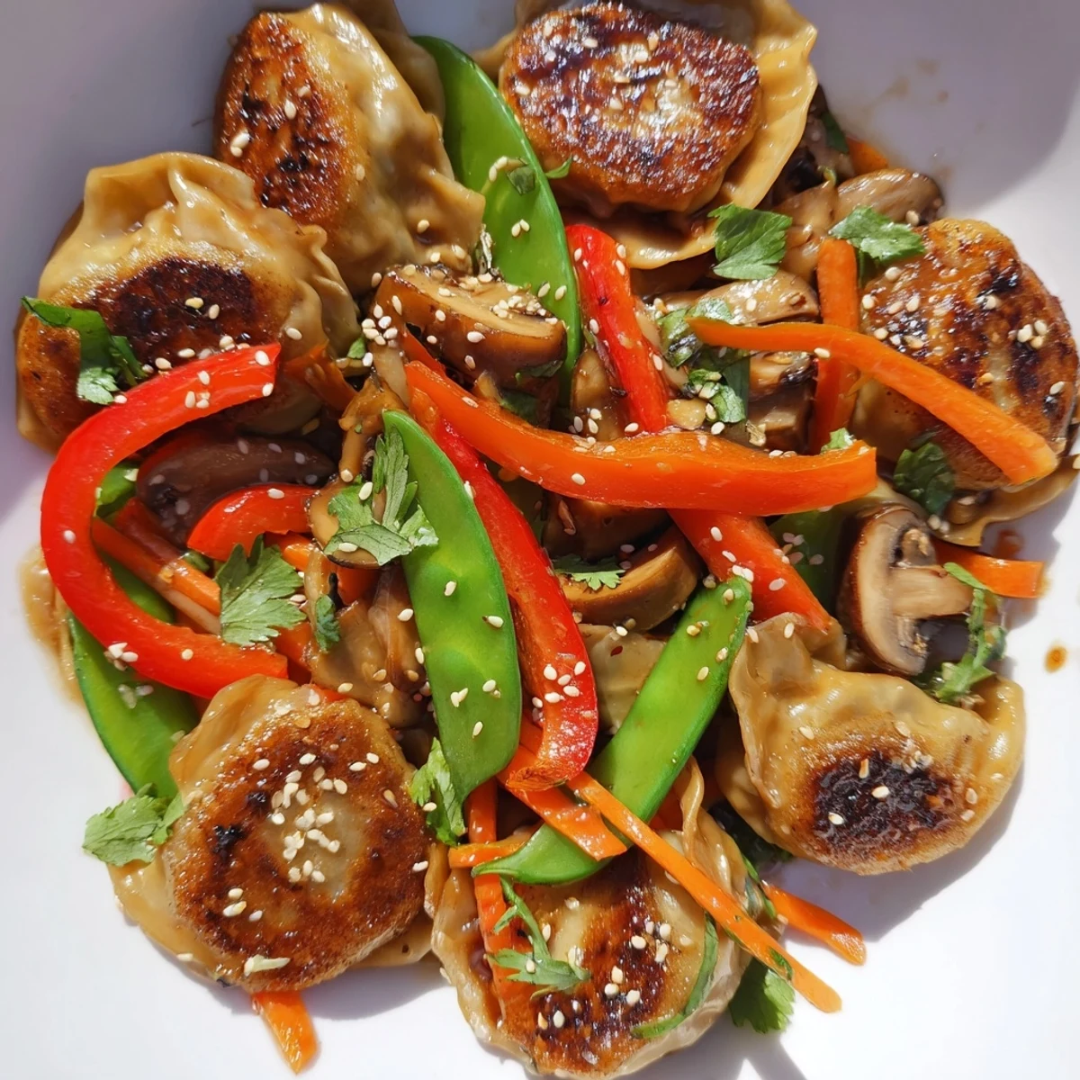 Vibrant Asian fusion stir fry featuring tender dumplings with crisp vegetables and sesame seed garnish