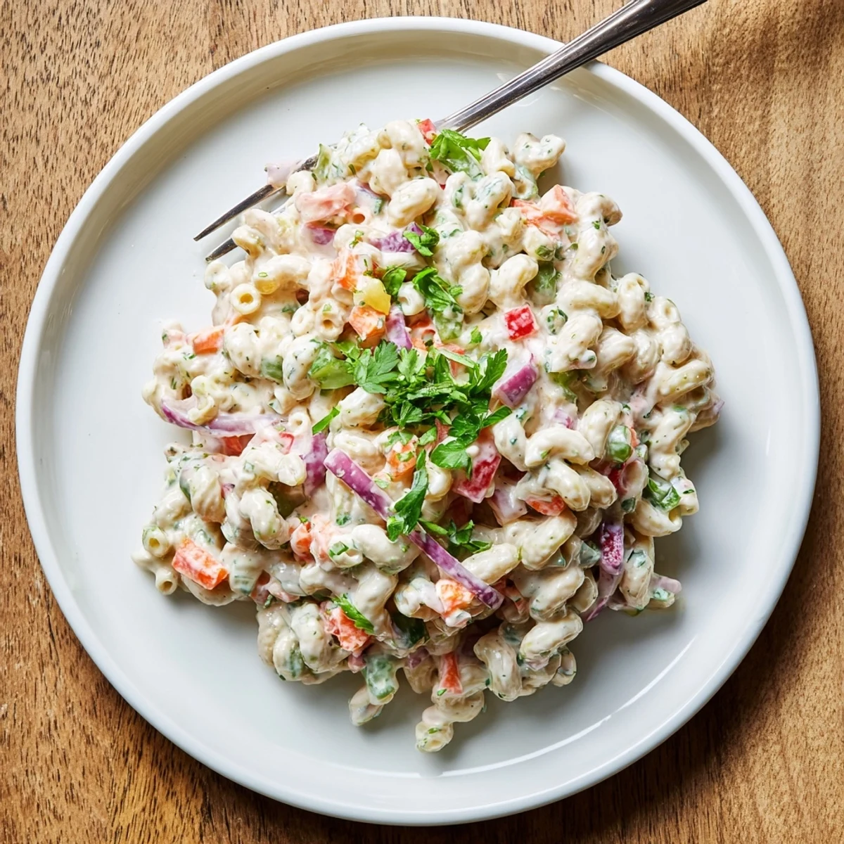 Creamy Tangy And Creamy Macaroni Salad loaded with colorful crunchy vegetables and rich dressing