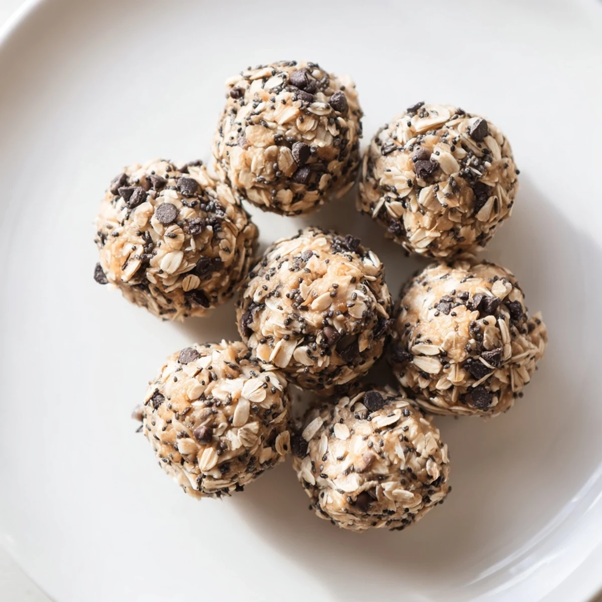 Bite-sized no-bake peanut butter energy balls topped with mini chocolate chips ready for healthy snacking