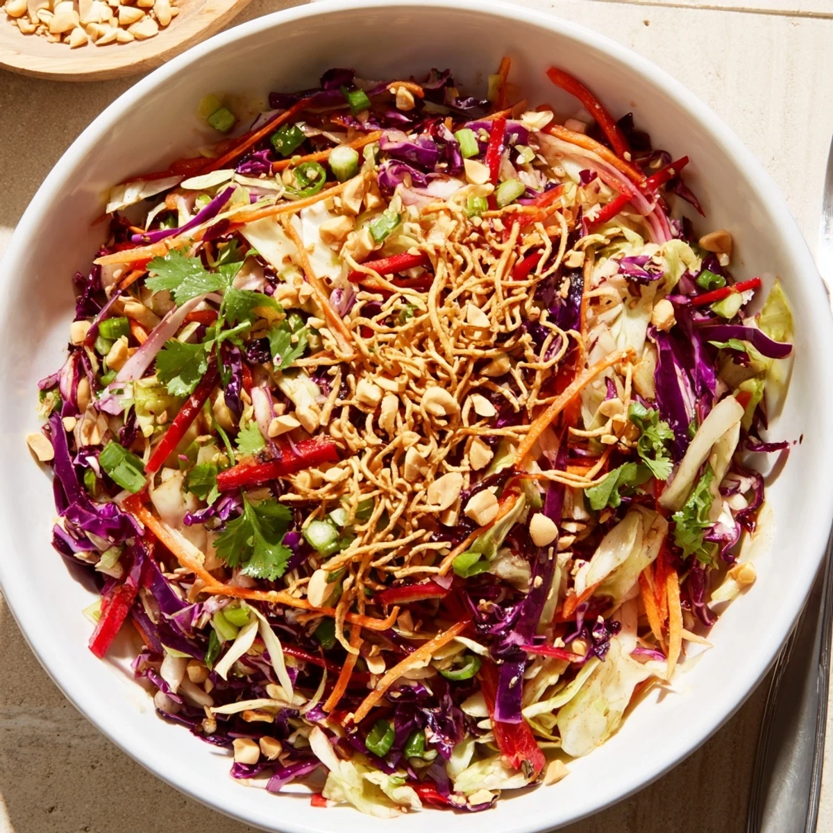 Bowl of Asian Cabbage Salad tossed with cilantro, lime, toasted sesame