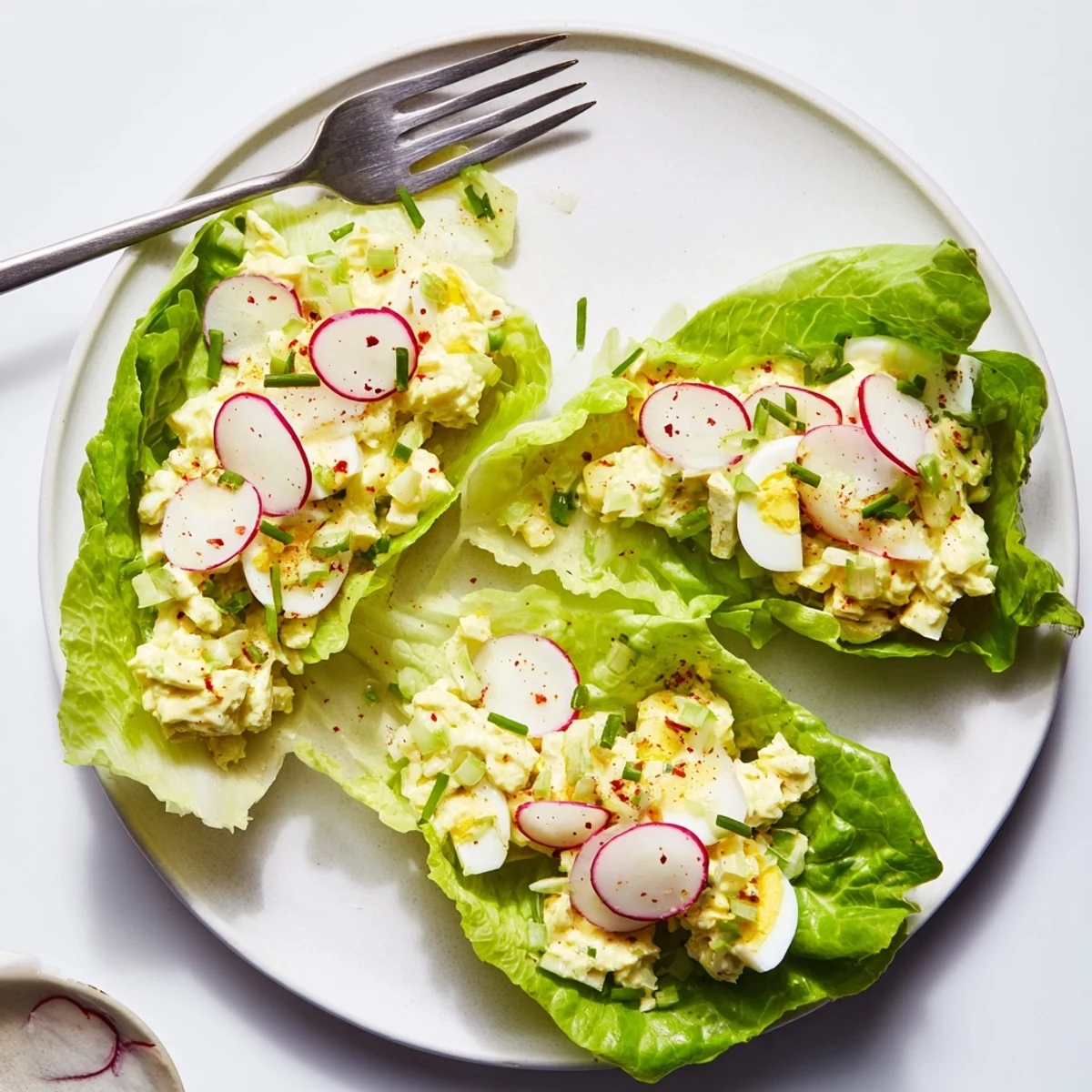 Serve Egg Salad Lettuce Wraps as low-carb lunch, garnished with paprika