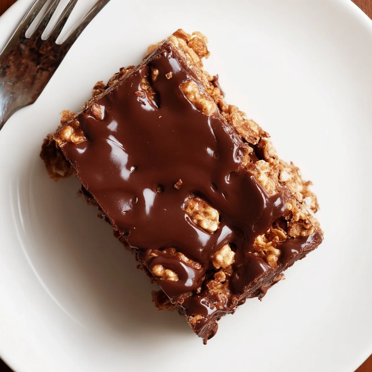 Cornflake Chocolate Fudge Bars glistening with glossy fudge, ready for party platters