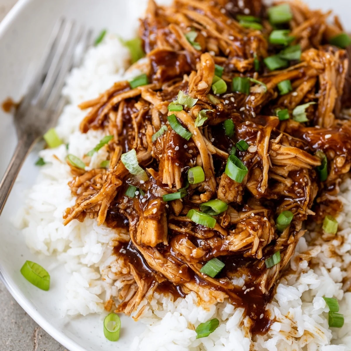 Steaming Crockpot Honey Garlic Chicken tender enough to shred, sweet garlicky aroma