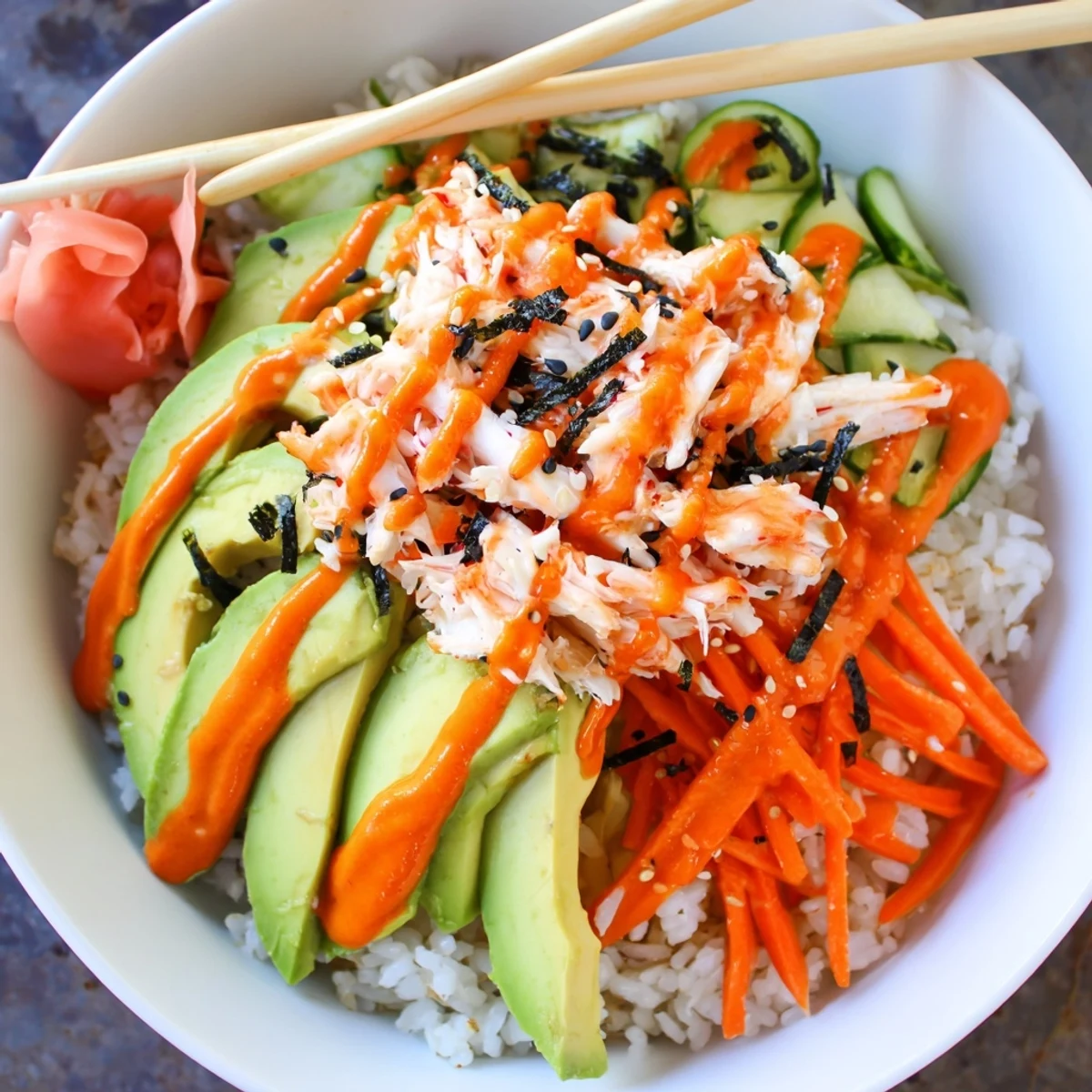 Aromatic rice, creamy avocado in California Roll Sushi Bowls served with pickled ginger