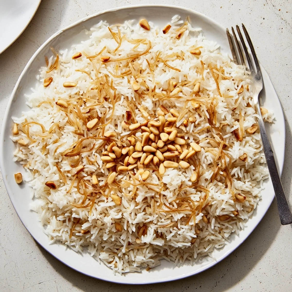 Golden buttery Lebanese rice with toasted vermicelli noodles served in a rustic bowl