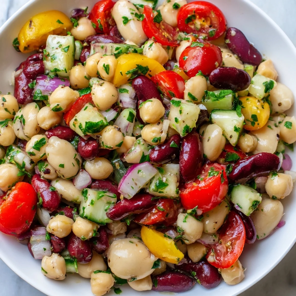 Colorful Italian bean salad tossed with crisp bell peppers and zesty herb dressing