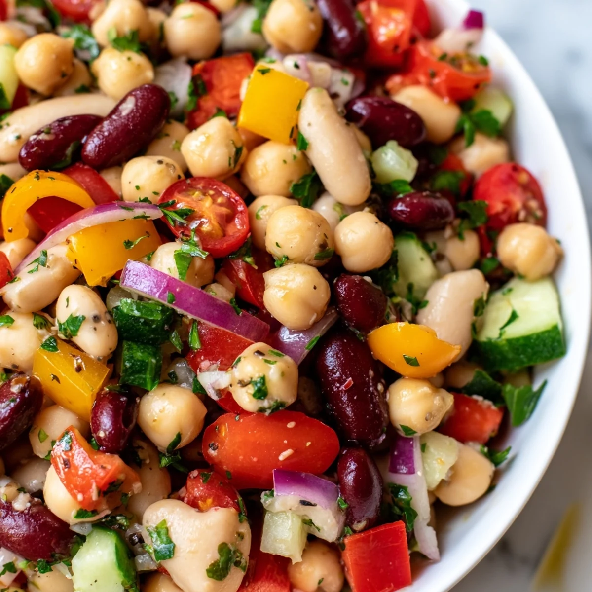 Vibrant Italian bean salad featuring tender chickpeas kidney beans and juicy cherry tomatoes