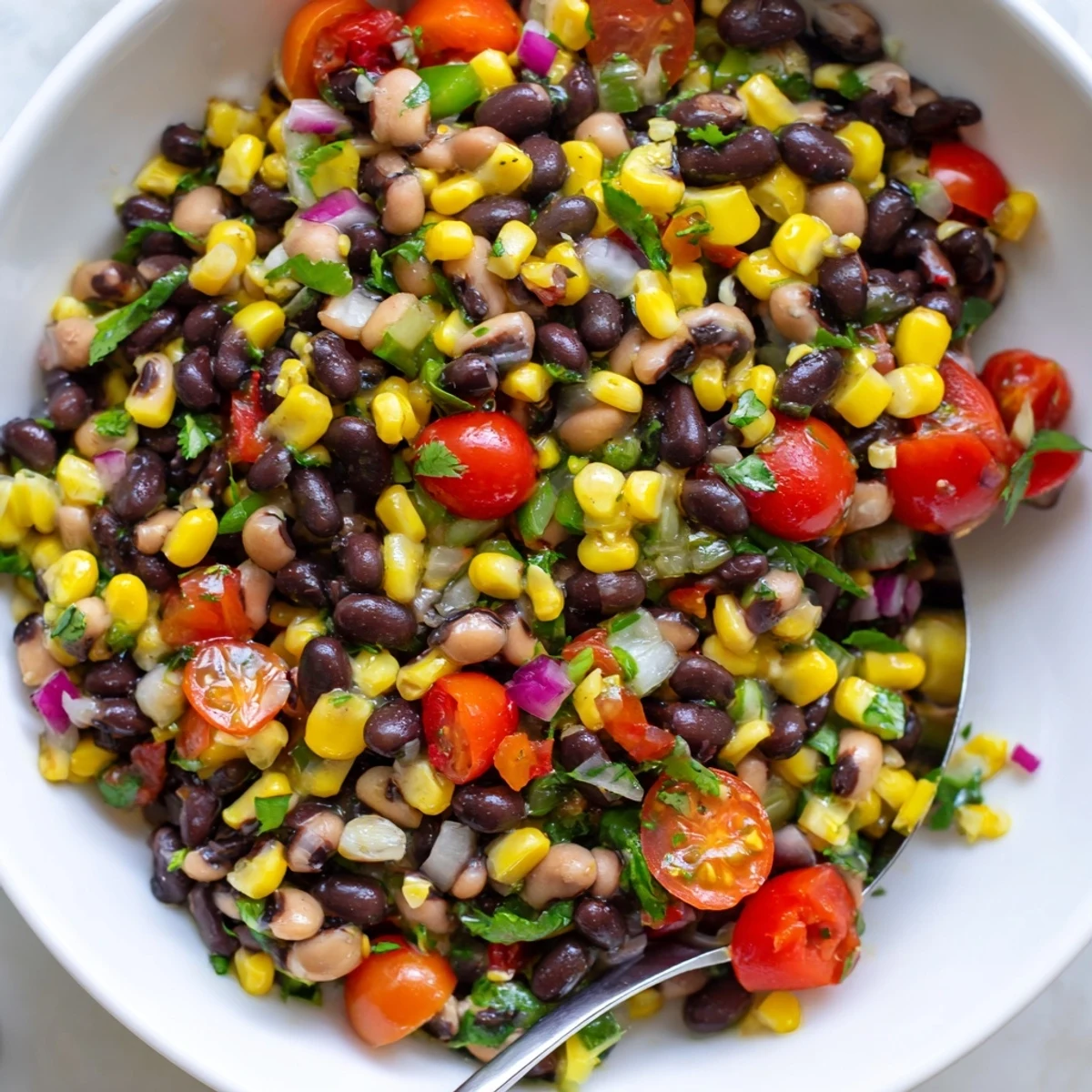Vibrant cowboy caviar recipe featuring black beans corn and a zesty lime dressing