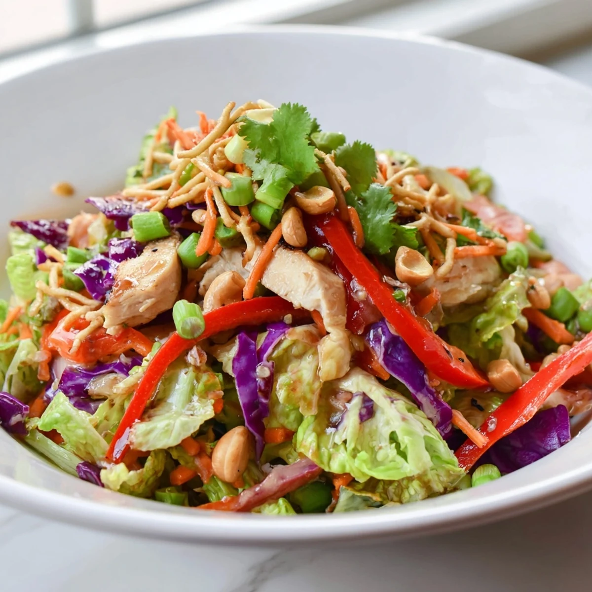 Colorful Chicken Cashew Crunch Salad with fresh vegetables and golden toasted cashews