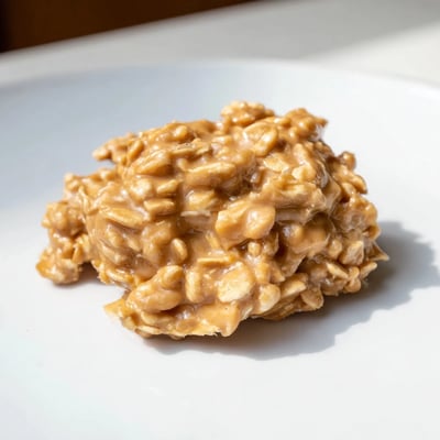 Chewy Peanut Butter No Bake Cookies on a white plate ready to serve.  